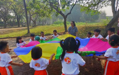 TK A 1 “Parachute games using ball. it called “don’t drop the ball (team play)”